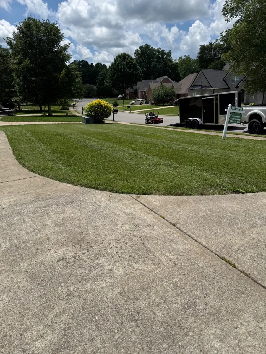 Freshly striped lawn completed by T&C in Clarksville