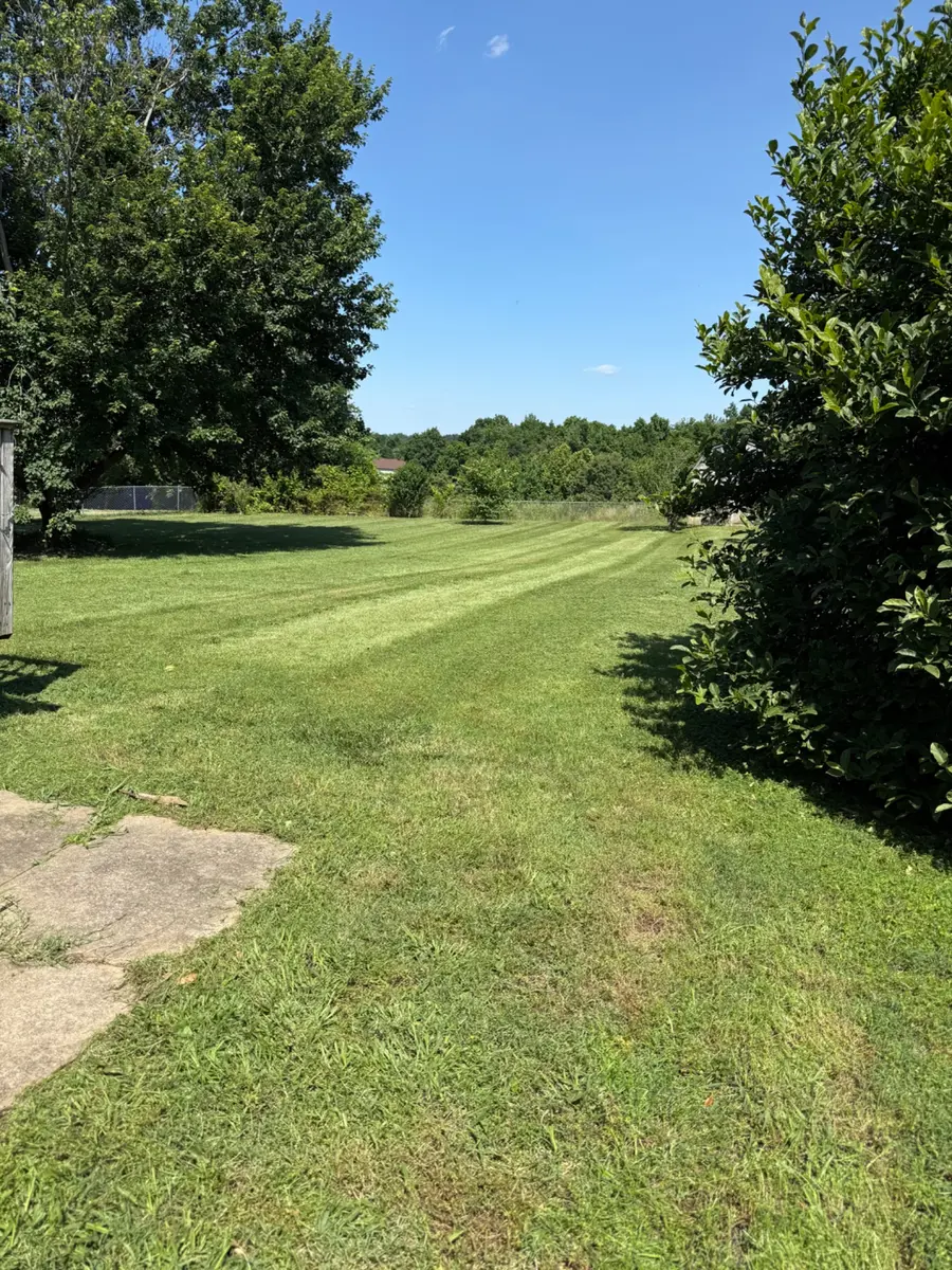 Professional striped lawn maintained by T&C Lawn Care in the Clarksville Tennessee area